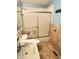 Bathroom featuring a vanity, toilet, and shower with sliding glass doors at 834 N Temple Ave, Indianapolis, IN 46201