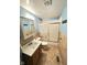 Bathroom featuring a vanity, toilet, and shower with sliding glass doors at 834 N Temple Ave, Indianapolis, IN 46201