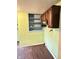 Kitchen with cabinets, shelves, and dated finishes at 834 N Temple Ave, Indianapolis, IN 46201