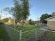 Large, fenced backyard with mature trees; great for outdoor entertaining and activities at 8417 S Sherman Dr, Indianapolis, IN 46237