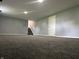 Finished basement with gray carpet and stairs leading up to the main floor at 8417 S Sherman Dr, Indianapolis, IN 46237