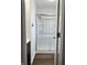 Bathroom featuring a glass door shower with a chrome handle and shelving at 8417 S Sherman Dr, Indianapolis, IN 46237