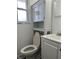 Bathroom featuring a toilet, vanity, and cabinet with marble windowsill at 8417 S Sherman Dr, Indianapolis, IN 46237