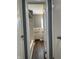 Bathroom view through doorway, showcasing tub with shower at 8417 S Sherman Dr, Indianapolis, IN 46237