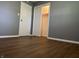 Bedroom featuring closet with double doors and wood-look flooring at 8417 S Sherman Dr, Indianapolis, IN 46237