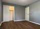 Bedroom with wood-look floors and closet at 8417 S Sherman Dr, Indianapolis, IN 46237