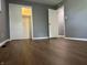 Spacious bedroom featuring wood-look flooring and closet with sliding doors at 8417 S Sherman Dr, Indianapolis, IN 46237