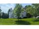 Expansive backyard featuring a deck and mature trees for privacy at 8598 Lantern Farms Dr, Fishers, IN 46038