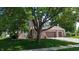 Charming brick two-story home with well-manicured lawn, mature trees, and a two-car garage at 8598 Lantern Farms Dr, Fishers, IN 46038