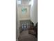 Bright and airy foyer featuring a staircase, chandelier, and large windows for natural light at 8598 Lantern Farms Dr, Fishers, IN 46038