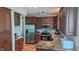 Updated kitchen featuring stainless steel appliances, granite countertops, and custom wood cabinetry at 8598 Lantern Farms Dr, Fishers, IN 46038