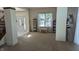 Inviting living room with a staircase, large windows, and ample natural light at 8598 Lantern Farms Dr, Fishers, IN 46038