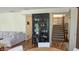 Cozy living room featuring a stylish bar cabinet, with a staircase leading to the upper level at 8598 Lantern Farms Dr, Fishers, IN 46038