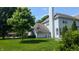 Back of house with large yard, mature trees, and vinyl siding at 8598 Lantern Farms Dr, Fishers, IN 46038