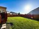 Large, fenced backyard featuring lush green grass, perfect for outdoor activities at 8644 N Deer Crossing Blvd, McCordsville, IN 46055