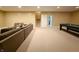 Spacious carpeted basement featuring neutral walls, a pool table, and an entertainment area with sofa and stairs at 8644 N Deer Crossing Blvd, McCordsville, IN 46055