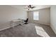 Spacious bedroom with neutral carpeting, a ceiling fan, and ample natural light at 8644 N Deer Crossing Blvd, McCordsville, IN 46055