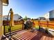 Outdoor deck with a grill, umbrella, and views of the fenced yard and surrounding neighborhood at 8644 N Deer Crossing Blvd, McCordsville, IN 46055