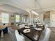 Bright, open dining room featuring a modern chandelier and seating for six at 8644 N Deer Crossing Blvd, McCordsville, IN 46055