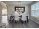 Elegant dining room featuring a dark wood table with seating for six and a stylish mirror at 8644 N Deer Crossing Blvd, McCordsville, IN 46055