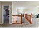 Second floor hallway with wood railings, and lots of natural light at 8644 N Deer Crossing Blvd, McCordsville, IN 46055