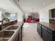 View from the kitchen showing stainless sink, counters and open floor plan at 8644 N Deer Crossing Blvd, McCordsville, IN 46055