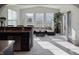 Bright living room with large windows, modern lighting, and sleek marble floors at 8644 N Deer Crossing Blvd, McCordsville, IN 46055