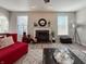 Well-lit living room featuring a fireplace, modern decor, and comfortable seating at 8644 N Deer Crossing Blvd, McCordsville, IN 46055