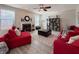 Cozy living room featuring a ceiling fan, fireplace, and large windows at 8644 N Deer Crossing Blvd, McCordsville, IN 46055