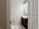 Stylish powder room with patterned wallpaper and updated vanity at 8644 N Deer Crossing Blvd, McCordsville, IN 46055