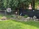 Beautiful backyard garden featuring decorative elements, rock features, and lush greenery, creating a serene outdoor space at 9521 Gemini Dr, Indianapolis, IN 46229
