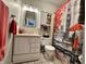Stylish bathroom with a modern vanity, decorative mirror, and London-themed shower curtain at 9521 Gemini Dr, Indianapolis, IN 46229