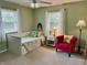 Cozy bedroom featuring a daybed, accent chair, and ample natural light at 9521 Gemini Dr, Indianapolis, IN 46229