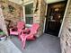Inviting front porch with comfortable seating and security door at 9521 Gemini Dr, Indianapolis, IN 46229