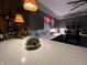 Kitchen with gray cabinets, marble countertop, mosaic backsplash, pendant lighting, and wine rack at 9521 Gemini Dr, Indianapolis, IN 46229