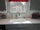 Bright kitchen with white countertops, subway tile backsplash, and modern fixtures at 9521 Gemini Dr, Indianapolis, IN 46229