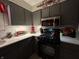 Modern kitchen with black appliances, grey cabinets, and sleek countertops, offering a stylish cooking space at 9521 Gemini Dr, Indianapolis, IN 46229