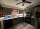 Gray kitchen with stainless steel appliances and gray cabinets at 9521 Gemini Dr, Indianapolis, IN 46229