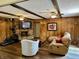 Spacious living room with wood floors and a brick fireplace at 9521 Gemini Dr, Indianapolis, IN 46229