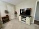 Living room featuring an entertainment center with barn doors and ample storage at 9521 Gemini Dr, Indianapolis, IN 46229