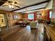 Cozy living room with wood floors and exposed wood beams at 9521 Gemini Dr, Indianapolis, IN 46229