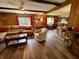 Spacious living room with hardwood floors flowing into dining area offers versatile living and entertaining at 9521 Gemini Dr, Indianapolis, IN 46229