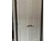 A close up of white paneled bi-fold pantry doors at 9521 Gemini Dr, Indianapolis, IN 46229