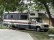 A vintage RV parked on a residential street at 9521 Gemini Dr, Indianapolis, IN 46229