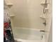 Clean white shower with built-in shelving and classic fixtures at 9521 Gemini Dr, Indianapolis, IN 46229