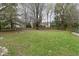 Large back yard with mature trees and a custom treehouse, perfect for outdoor enjoyment at 10764 Northhampton Dr, Fishers, IN 46038