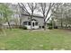 Spacious backyard with a screened porch and patio area, ideal for relaxation and outdoor living at 10764 Northhampton Dr, Fishers, IN 46038