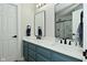 Stylish bathroom featuring a double vanity with quartz countertop and modern fixtures at 10764 Northhampton Dr, Fishers, IN 46038