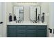 Modern bathroom features a double vanity with quartz countertop and black fixtures at 10764 Northhampton Dr, Fishers, IN 46038