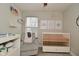 Neutral Bedroom features soft glider, white crib, and simple wall decor at 10764 Northhampton Dr, Fishers, IN 46038